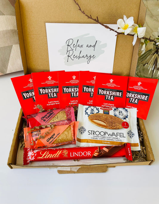 The box contains a variety of snacks, including Yorkshire tea bags, Lindt lindor chocolate bar, 2 packs of biscuits and a stroopwafel. With an option of gift cards and your own personalised message delivered straight to the recipient