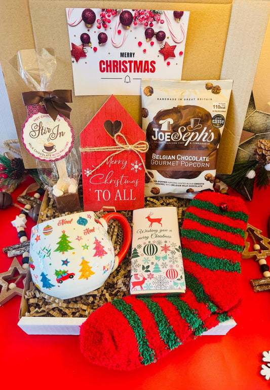 our Ladies Christmas Hamoer comes with a Christmas cup, cosy red and green socks, hot chocolate stirrer, chocolate flavoured popcorn, merry Christmas chocolate bar and a wooden Christmas decoration. Comes gift wrapped with your own personalised message ready to send direct to the recipient