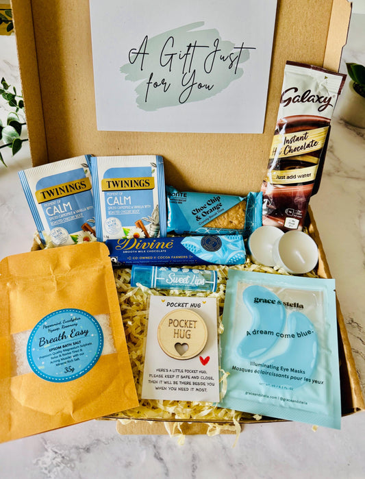 our hug in a box relaxation gift comes with bath salts, a hug token keepsake, under eye mask, tea light candles, pack of biscuits, divine chocolate bar, herbal tea, hot chocolate and a lip balm….comes with your own personalised message ready to send direct to the recipient